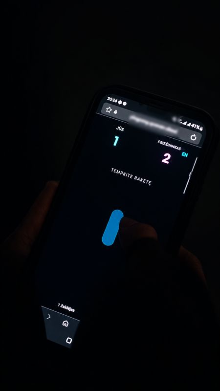 A visitor’s phone at Ping Pong showing the score and a paddle to drag